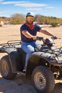 Man Sits on ATV while Looking at the Camera